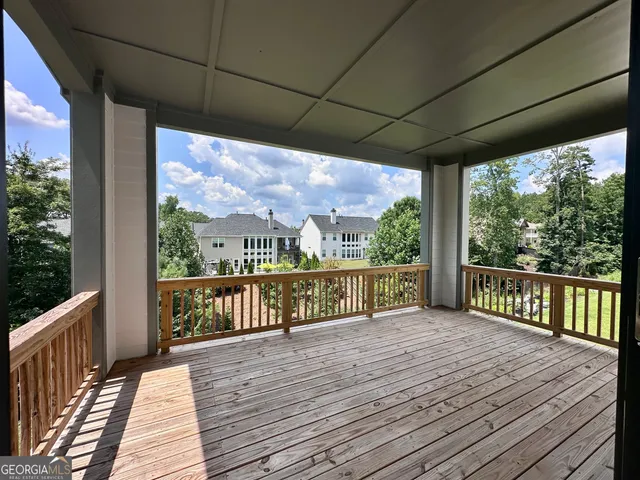 a view of balcony with wooden floor