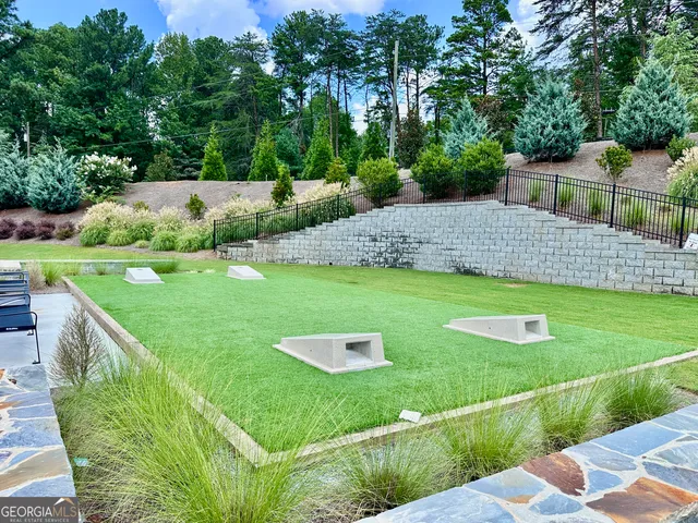 a view of a garden with an apartment