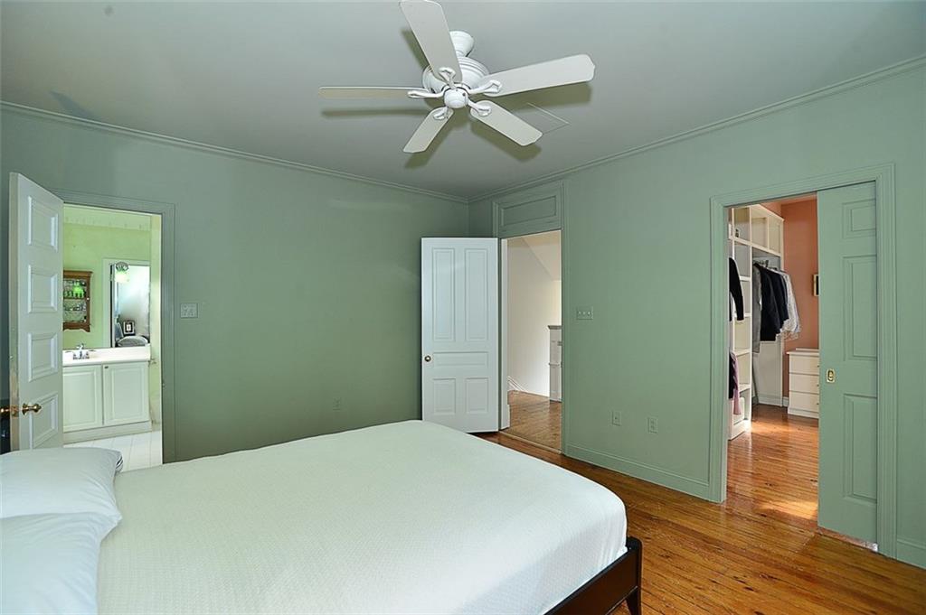 304 Bower Hill Road Pittsburgh, PA 15228 - Photo 13 of 25 This view of the master bedroom provides a glimpse of the huge walk in closet with custom built ins as well as a view of the full bath.