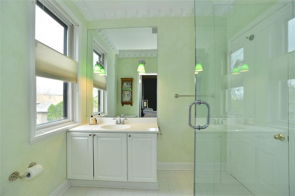 304 Bower Hill Road Pittsburgh, PA 15228 - Photo 15 of 25 This updated full bath off the master bedroom is so calming with its cool paint tones and fresh crisp look! The walls are topped with dentil molding.