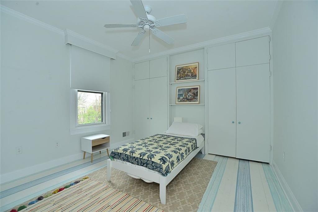 304 Bower Hill Road Pittsburgh, PA 15228 - Photo 17 of 25 Bedroom two features high ceilings, crown molding, paddle fan, custom closets and artistic paint accents on the floor.