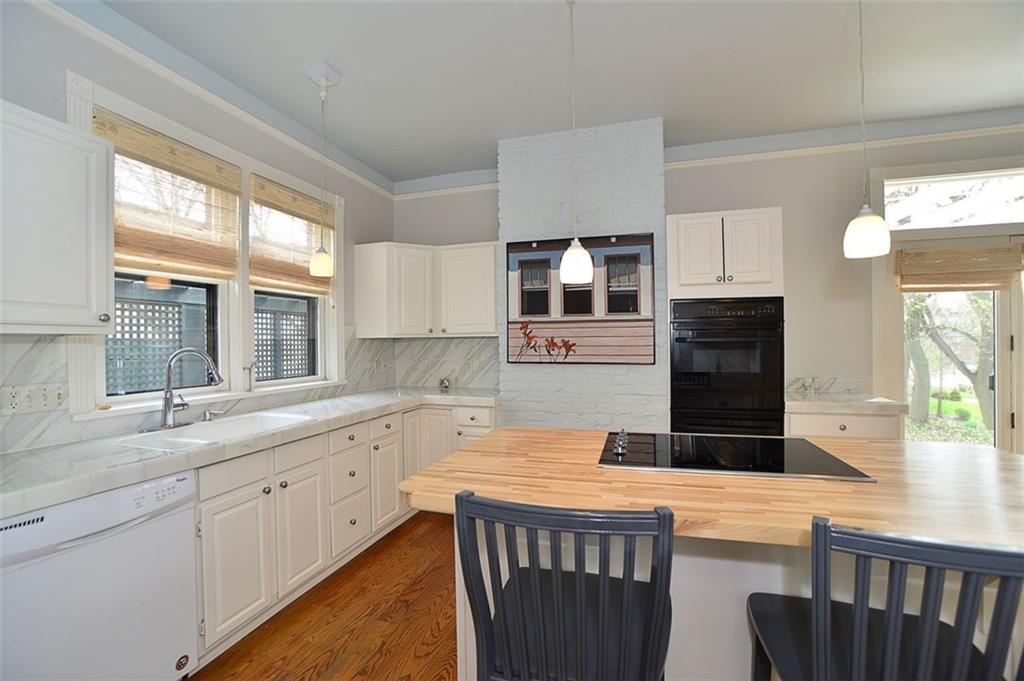 304 Bower Hill Road Pittsburgh, PA 15228 - Photo 9 of 25 This view of the kitchen shows the amount of natural light which enters the room. The hardwood floors add warmth to the soft gray walls. Simply stunning!