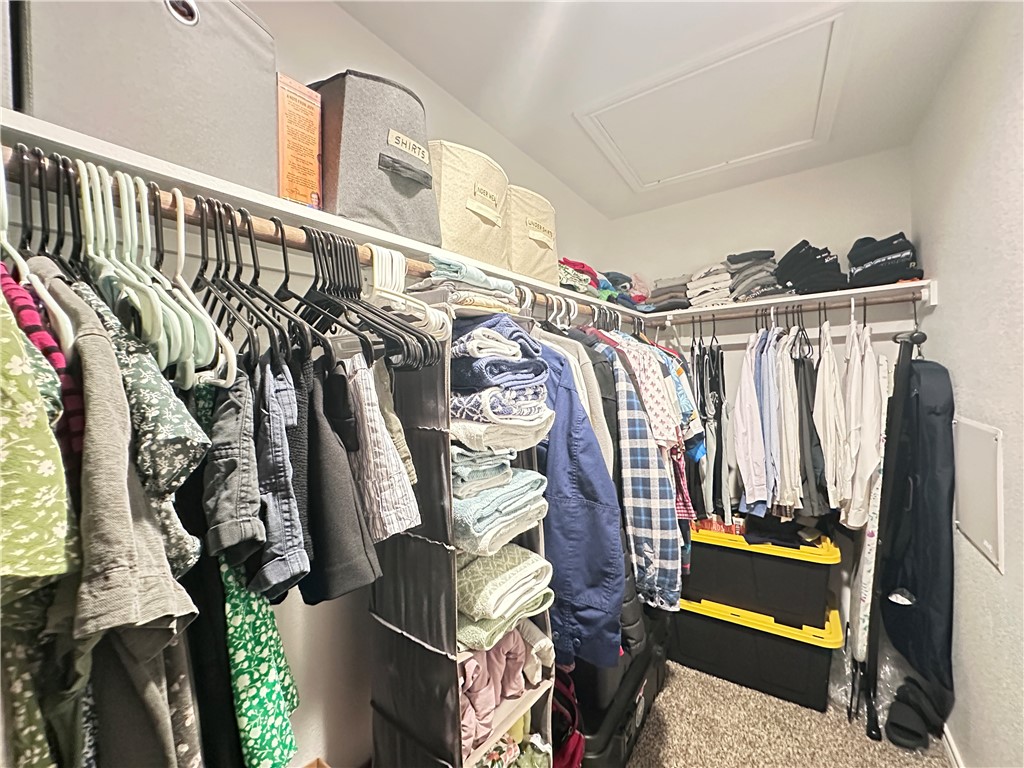 7649 Herd Rider Lane Corpus Christi, TX 78414 - Photo 12 of 18 a view of walk in closet with clothes and shoes