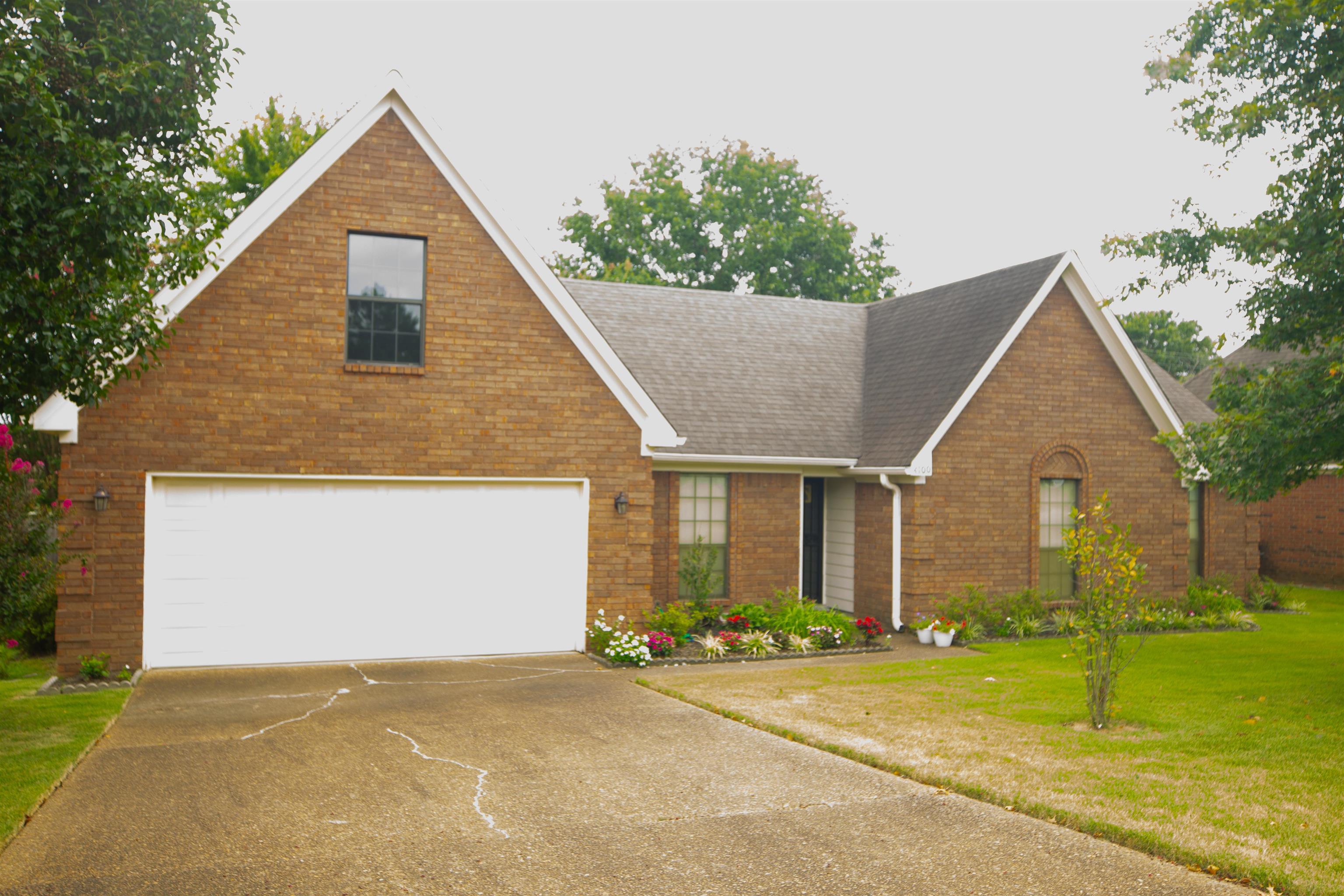 4100 Altruria Road Bartlett, TN 38135 - Photo 1 of 23 View of front of house featuring a garage and a front lawn