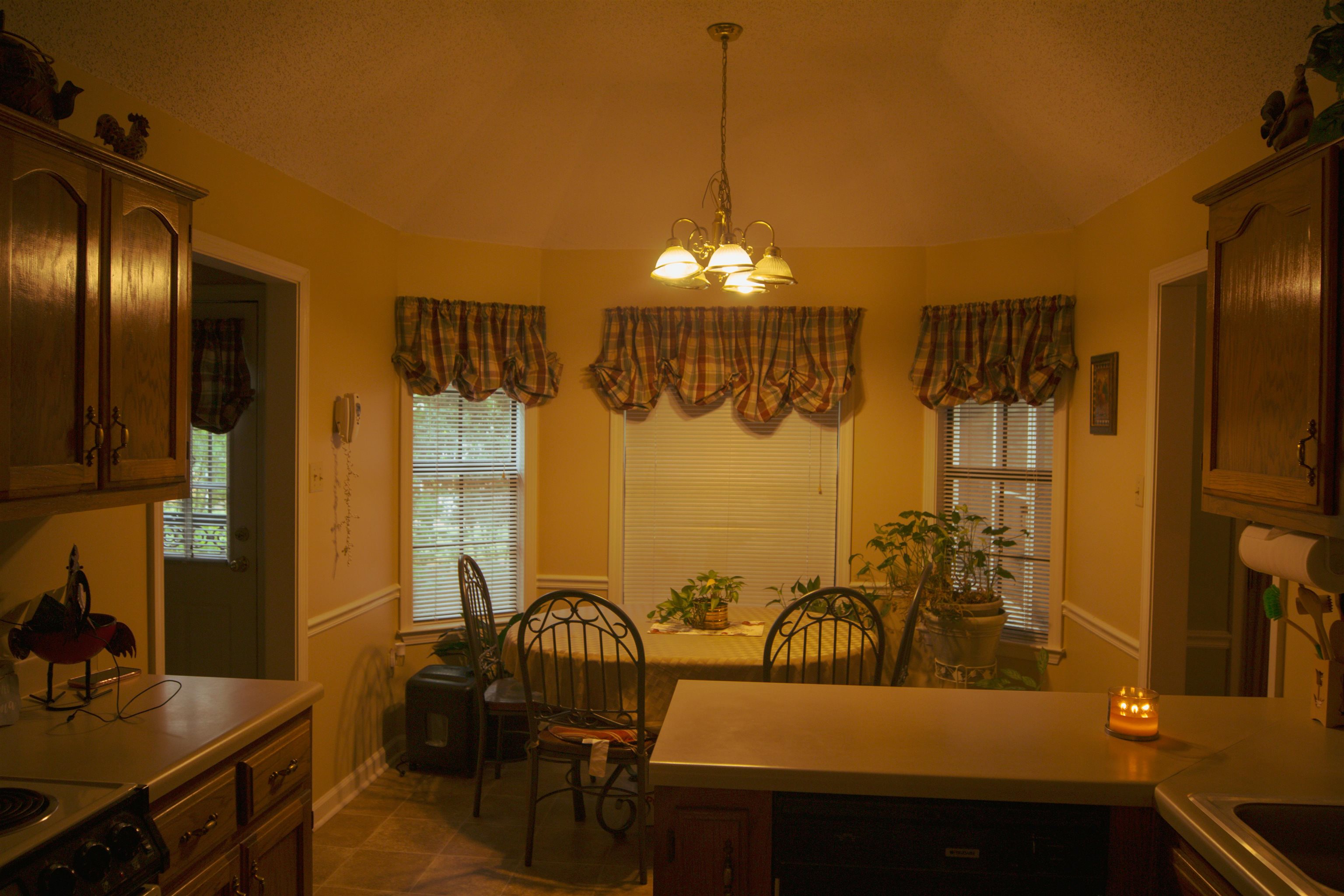 4100 Altruria Road Bartlett, TN 38135 - Photo 8 of 23 Dining area featuring light tile patterned floors, lofted ceiling, and a chandelier