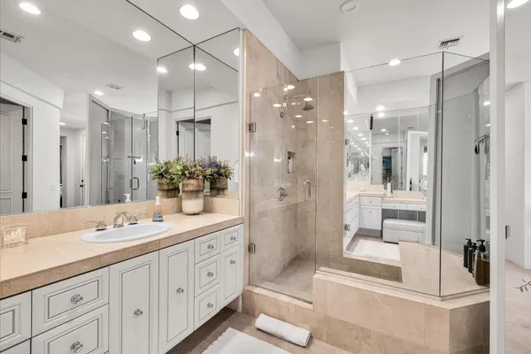 a bathroom with a bathtub and a window