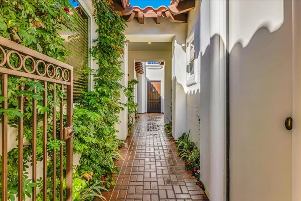 a living room with furniture and chandelier