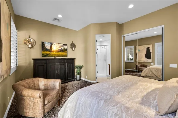 a kitchen with stainless steel appliances granite countertop a refrigerator and a stove