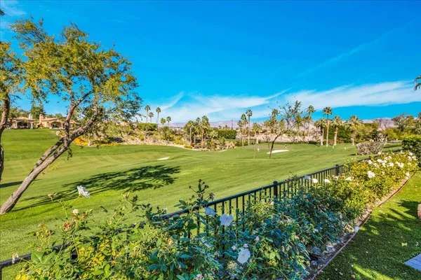 a view of swimming pool with seating space