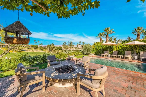 a view of a lush green hillside and houses