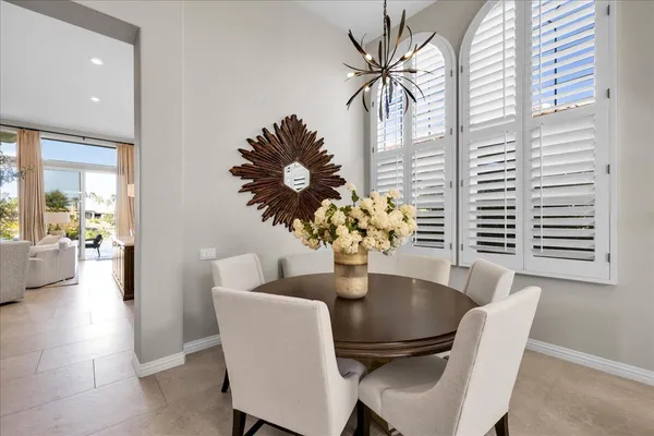 a dining room with furniture and window