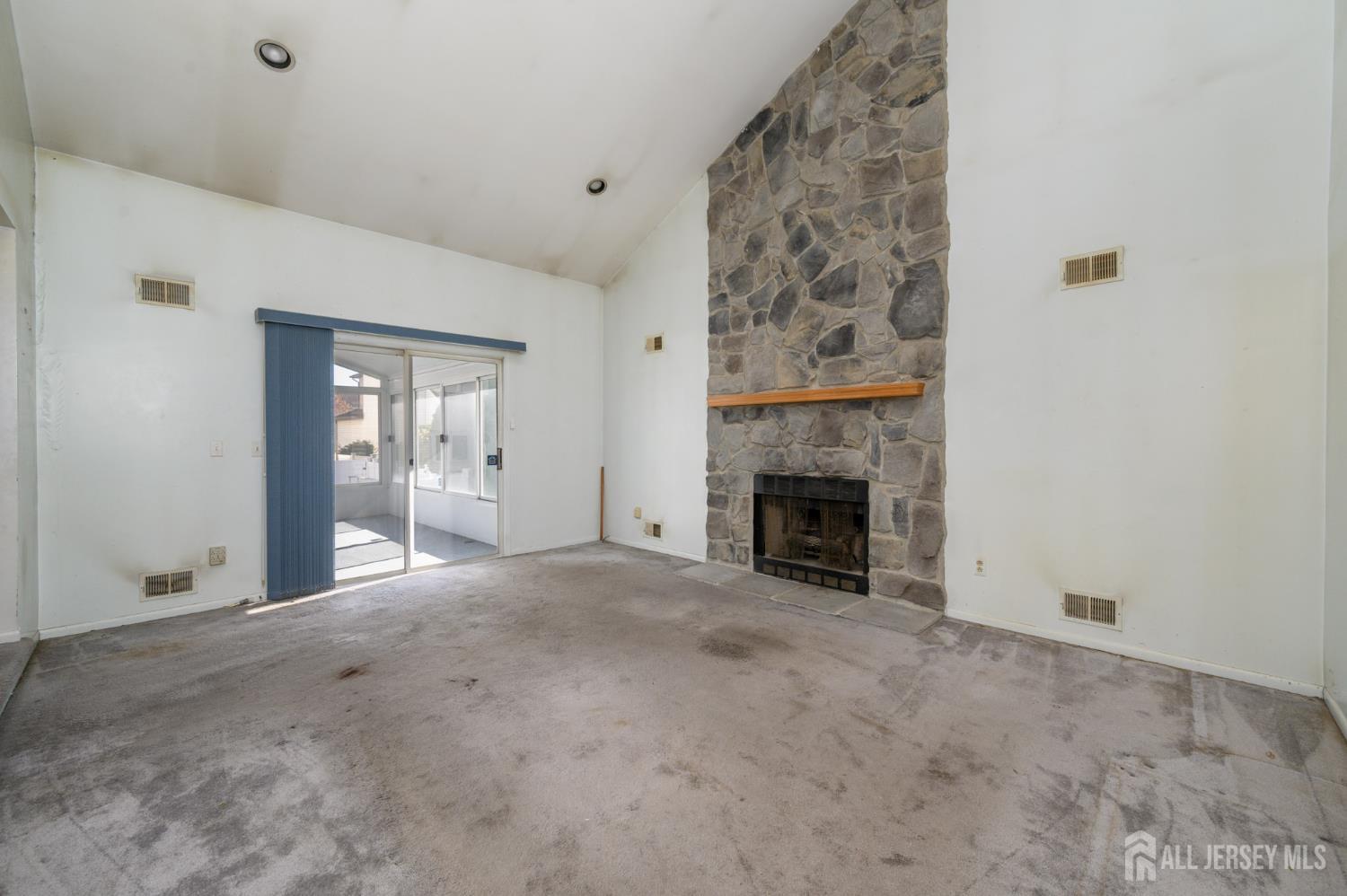 112 Apple Tree Lane Union, NJ 07083 - Photo 13 of 46 a view of an empty room with a fireplace