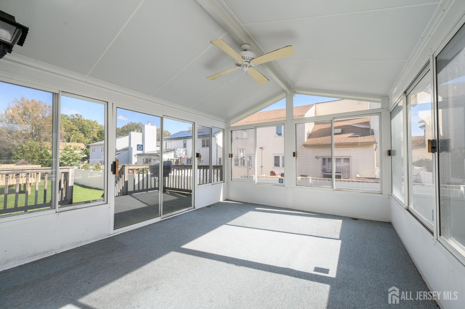 112 Apple Tree Lane Union, NJ 07083 - Photo 16 of 46 a large white room with a large window and a table
