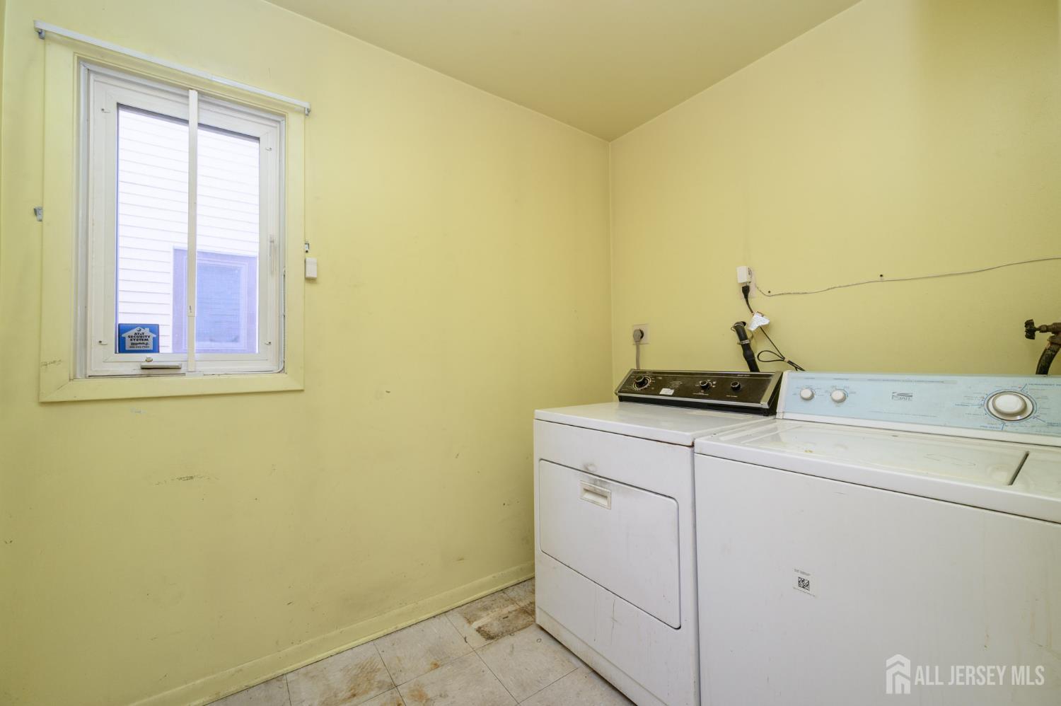112 Apple Tree Lane Union, NJ 07083 - Photo 19 of 46 a utility room with dryer and washer
