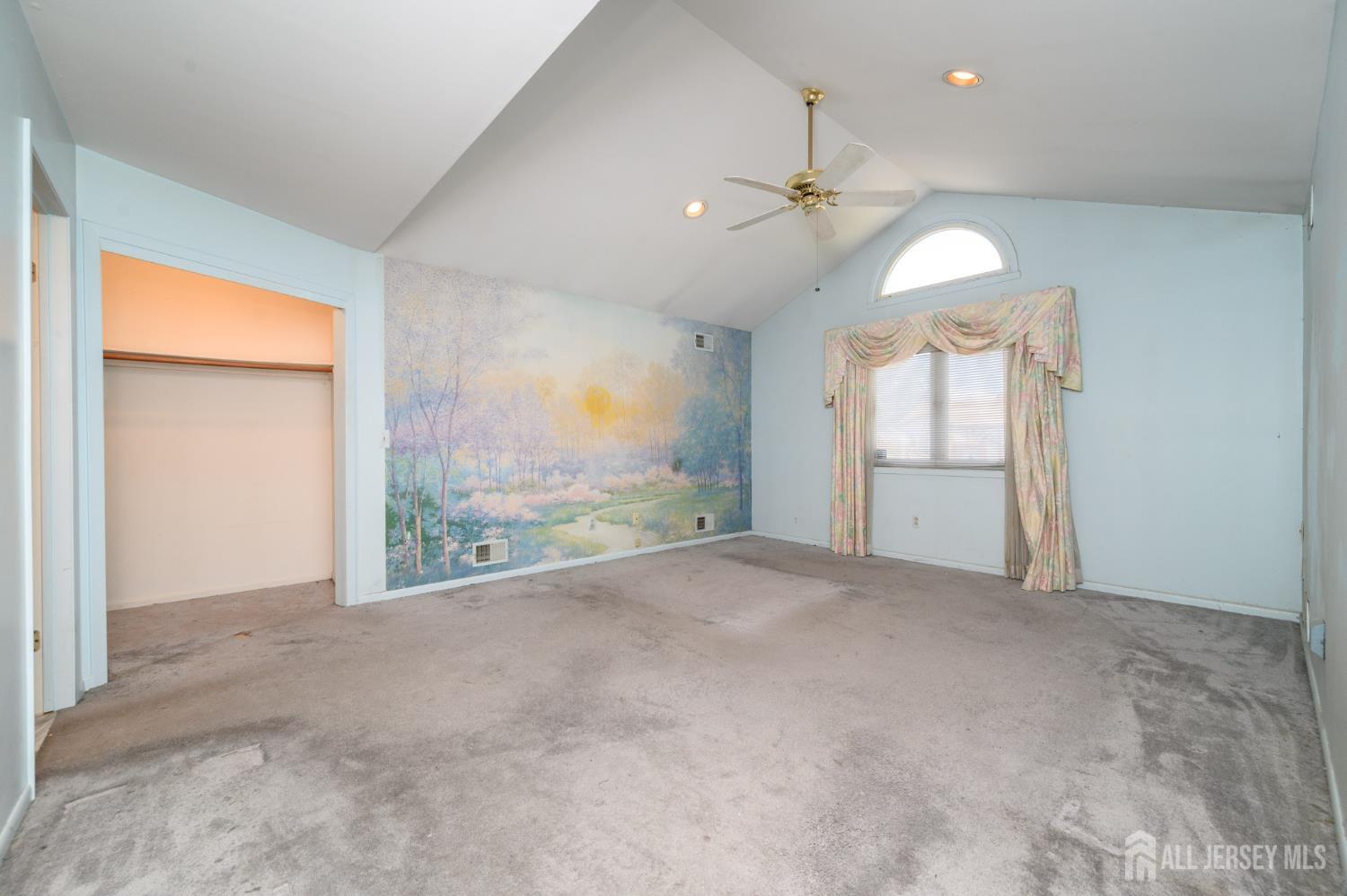 112 Apple Tree Lane Union, NJ 07083 - Photo 20 of 46 en empty room with windows and chandelier