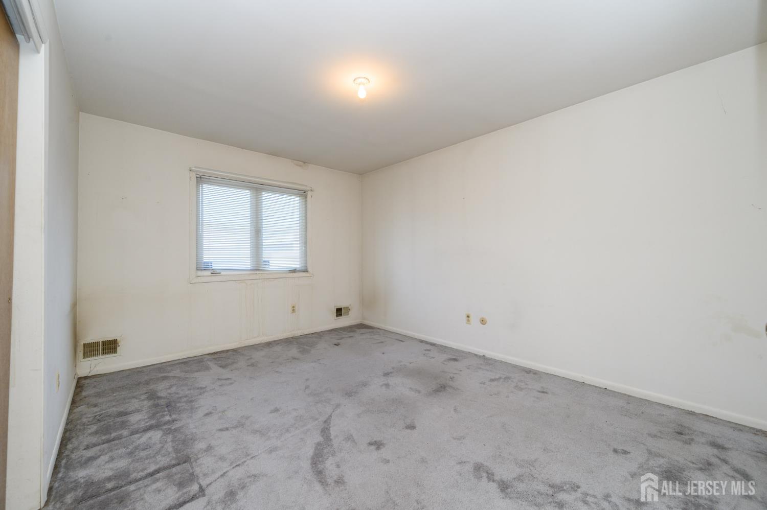 112 Apple Tree Lane Union, NJ 07083 - Photo 26 of 46 an empty room with a window