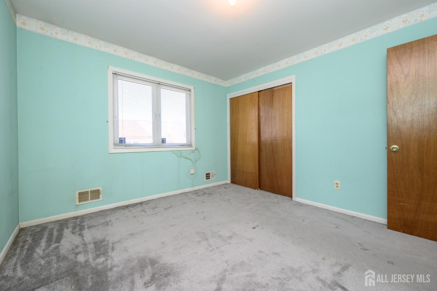 112 Apple Tree Lane Union, NJ 07083 - Photo 28 of 46 an empty room with windows