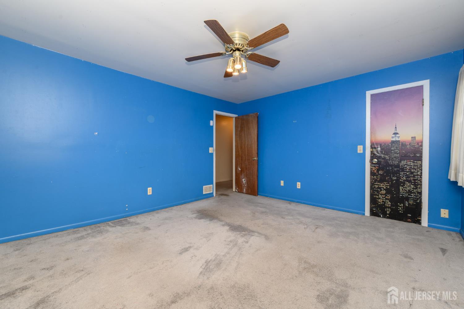 112 Apple Tree Lane Union, NJ 07083 - Photo 31 of 46 an empty room with closet and fan