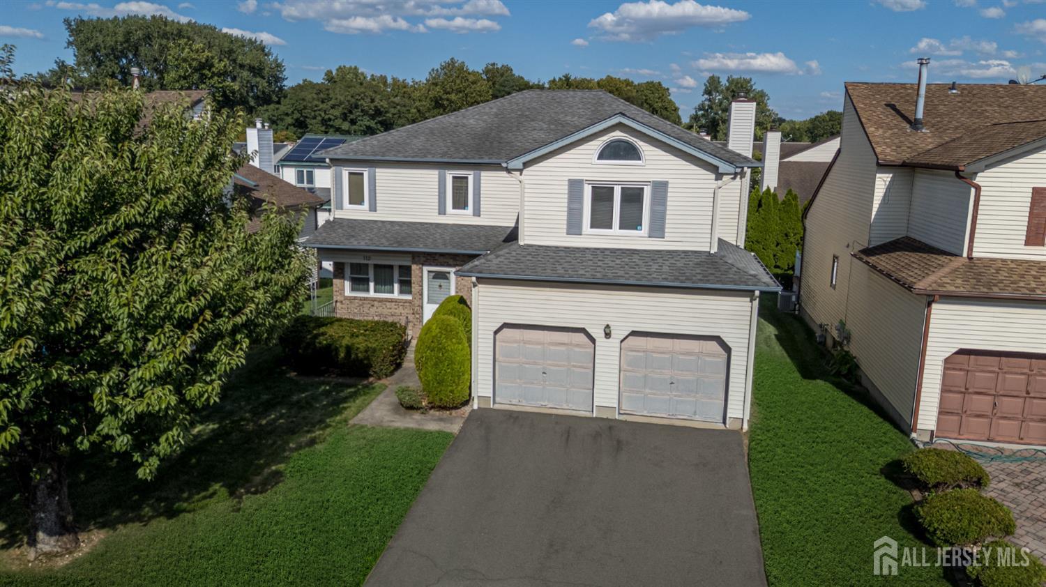 112 Apple Tree Lane Union, NJ 07083 - Photo 40 of 46 a view of a white house next to a yard