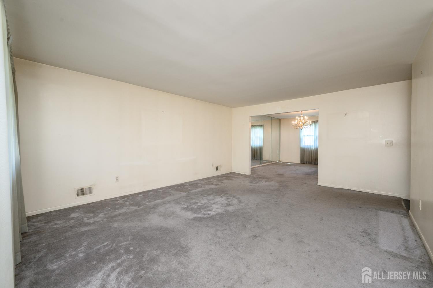 112 Apple Tree Lane Union, NJ 07083 - Photo 4 of 46 a view of an empty room and window