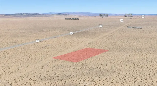 a view of an ocean beach and mountain