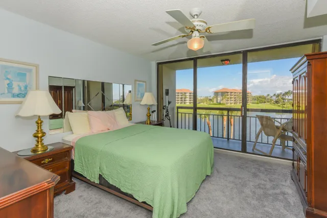 a bedroom with a large bed and a large window