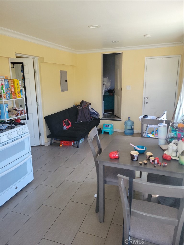 5240 Appleton Street Riverside, CA 92504 - Photo 13 of 16 a living room with furniture and flat screen tv