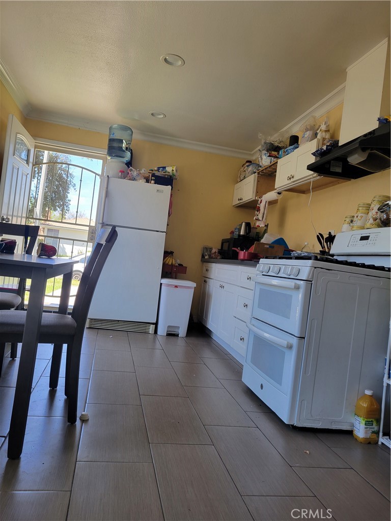 5240 Appleton Street Riverside, CA 92504 - Photo 16 of 16 a room with furniture and a table