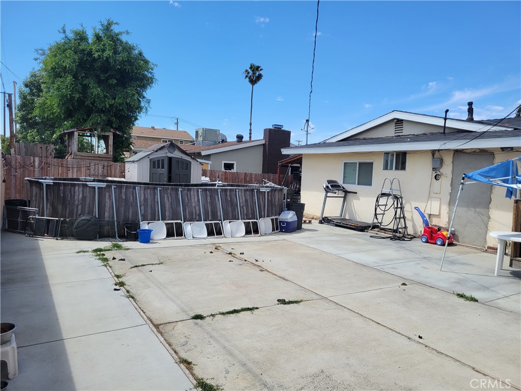 5240 Appleton Street Riverside, CA 92504 - Photo 4 of 16 a view of a house with wooden fence