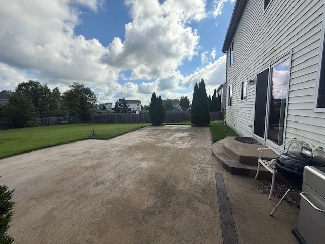 a view of a backyard with sitting area