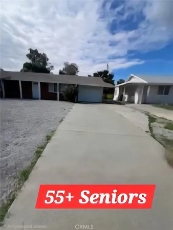 a front view of a house with a big yard