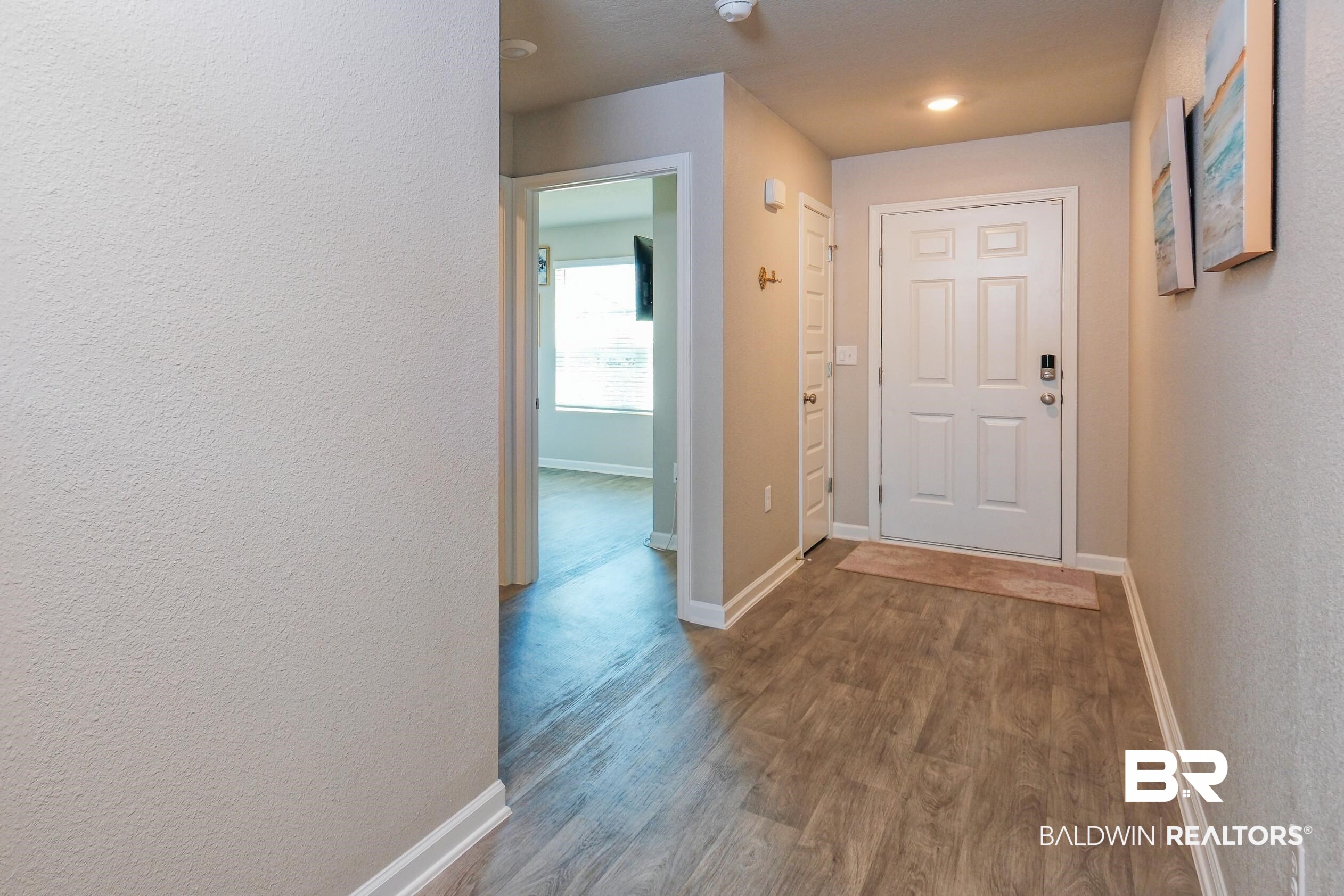 7425 Coppin Drive Foley, AL 36535 - Photo 28 of 41 Hallway featuring hardwood / wood-style floors