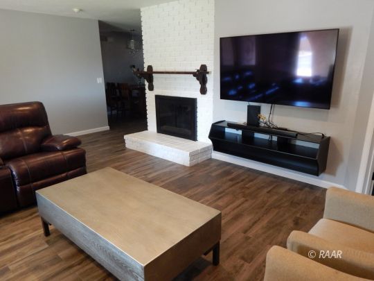 517 Suzanne Street Ridgecrest, CA 93555 - Photo 6 of 34 a living room with furniture and a flat screen tv