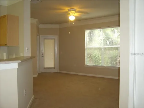 a view of an empty room with a window