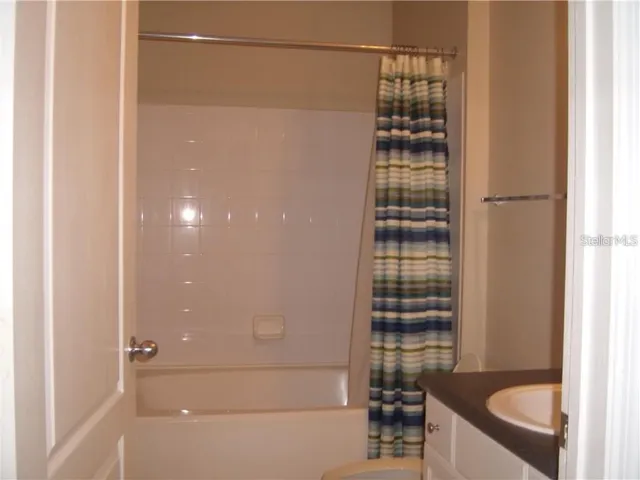 a bathroom with a bathtub and shower