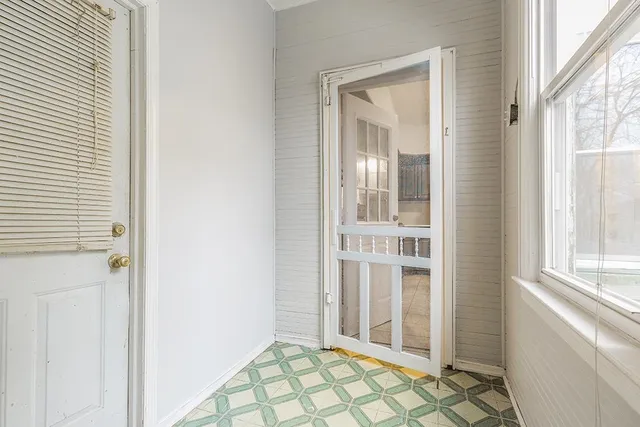 a view of a bathroom with a sink and a window