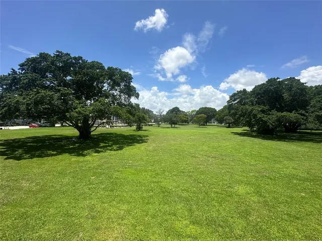 a view of a golf course with a lake