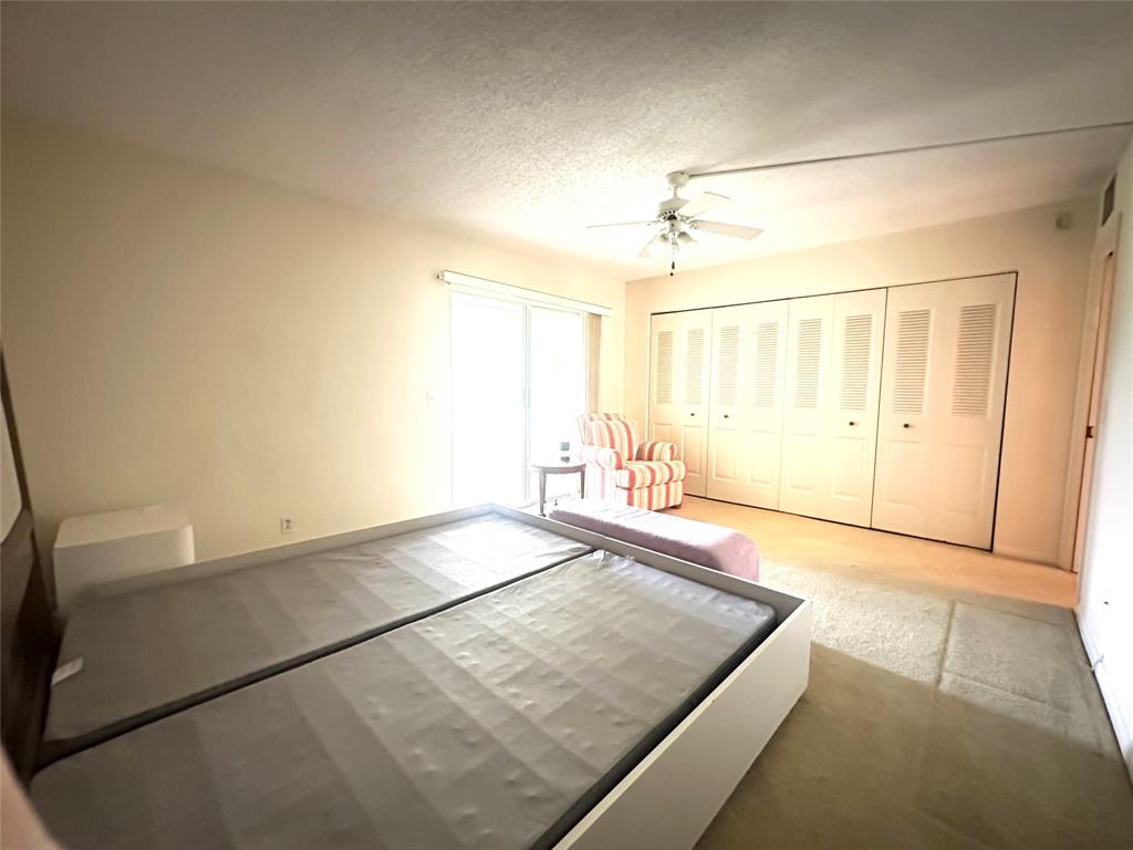 2009 Berkshire A, Unit 2009 Deerfield Beach, FL 33442 - Photo 14 of 57 a view of a room with an empty space