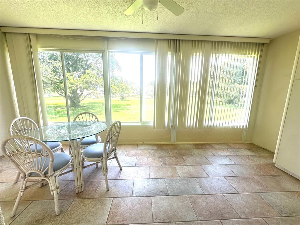 2009 Berkshire A, Unit 2009 Deerfield Beach, FL 33442 - Photo 21 of 57 a view of a room with furniture and a window