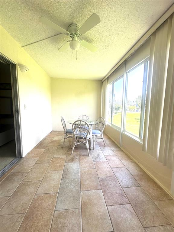 2009 Berkshire A, Unit 2009 Deerfield Beach, FL 33442 - Photo 22 of 57 a view of a room with furniture and a window