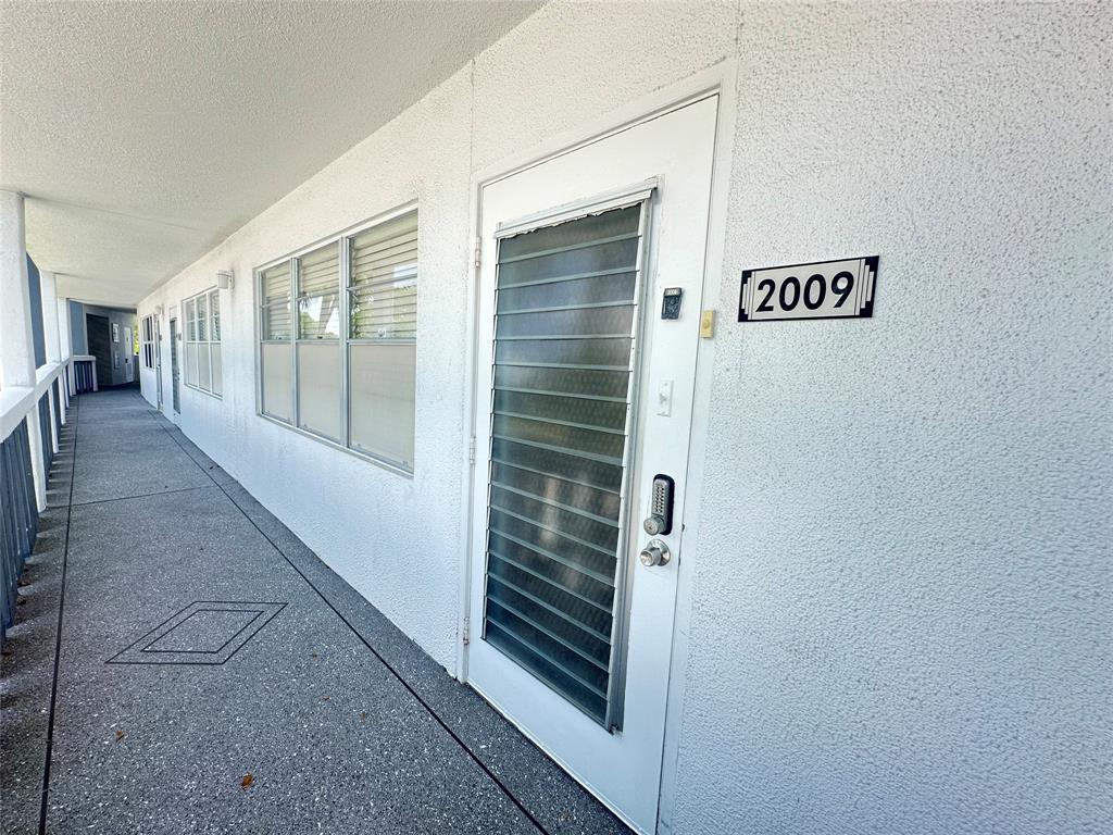 2009 Berkshire A, Unit 2009 Deerfield Beach, FL 33442 - Photo 23 of 57 a view of a hallway