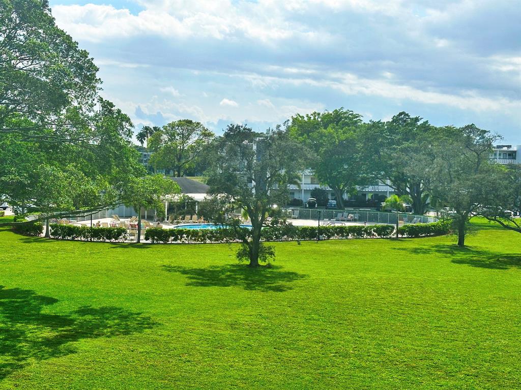 2009 Berkshire A, Unit 2009 Deerfield Beach, FL 33442 - Photo 24 of 57 a view of a park with large trees