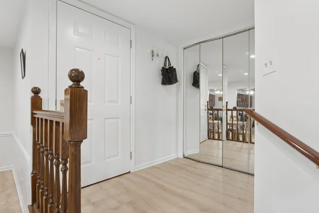 a view of a walk in closet and living room