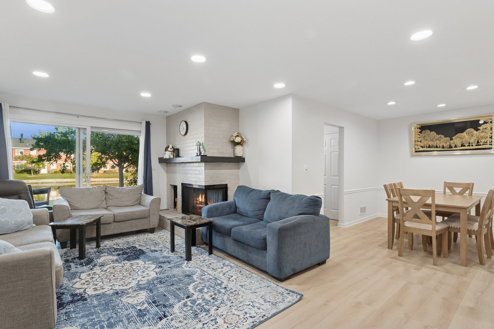 7235 Willow Way Lane, Unit B Willowbrook, IL 60527 - Photo 6 of 20 a living room with furniture and a large window