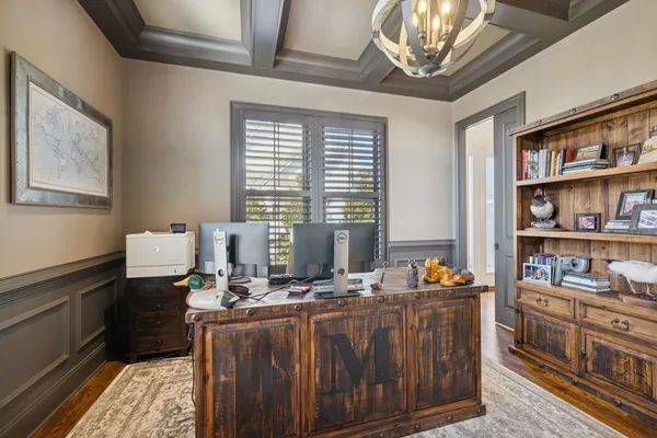 a kitchen with granite countertop a sink stove and cabinets