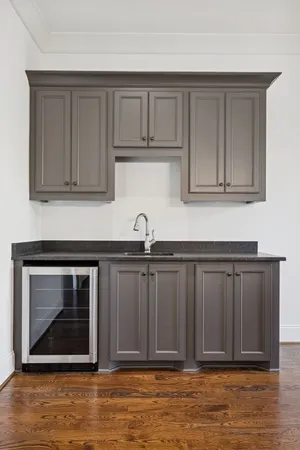 a room with a book shelf and a dining table