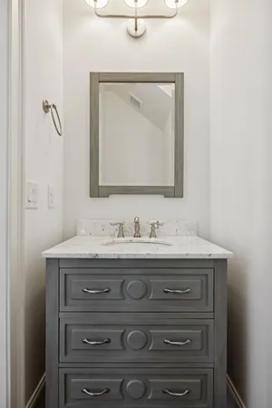 a room with pool table and windows