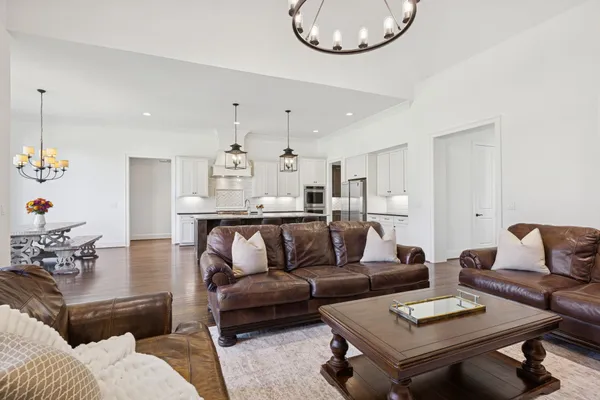 a spacious bathroom with a double vanity sink a mirror and a bathtub