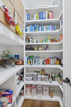 a view of a livingroom with furniture and staircase