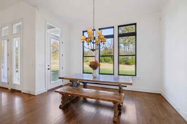 a room with a bed and a large window